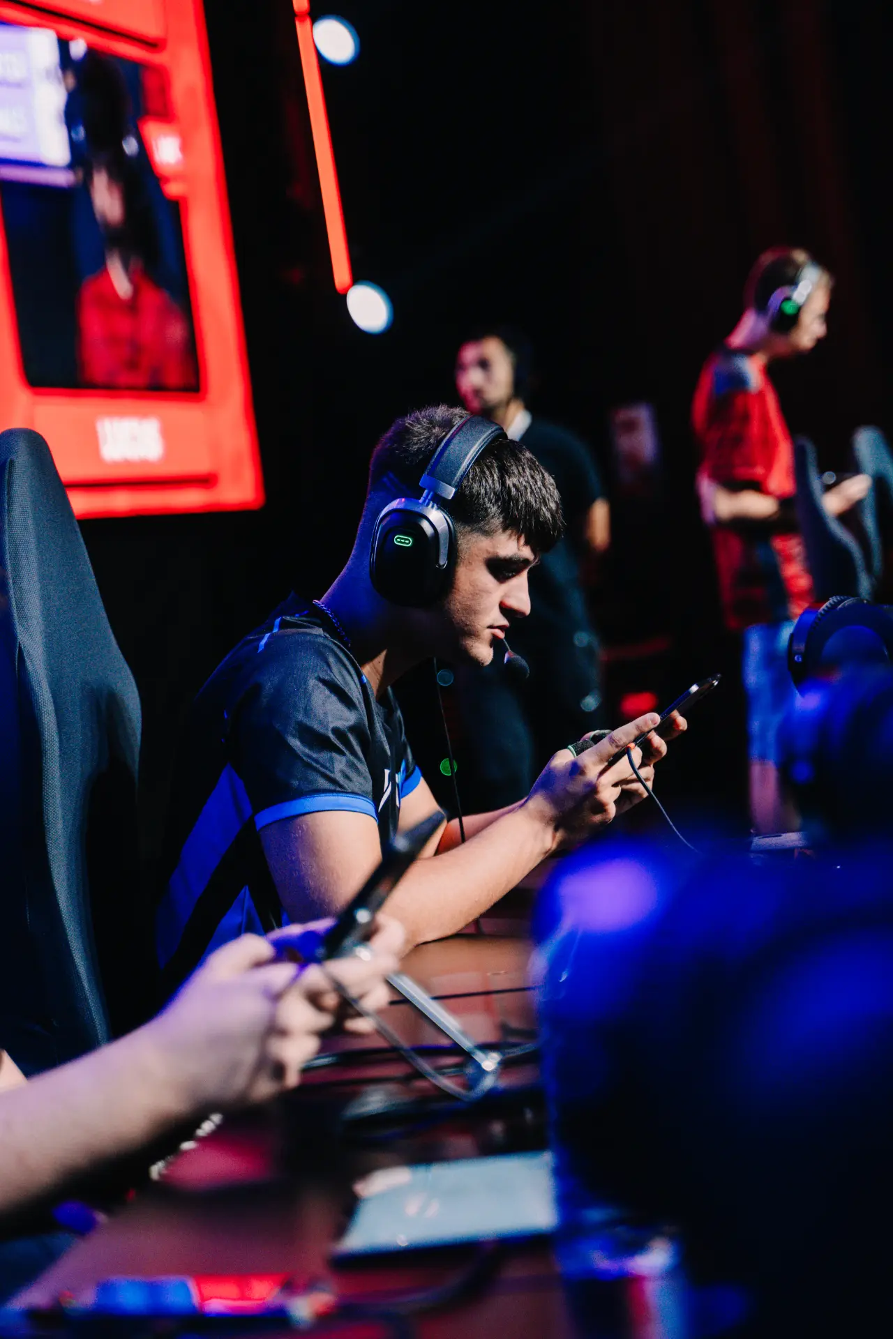 TLF player focused at the desk during competition