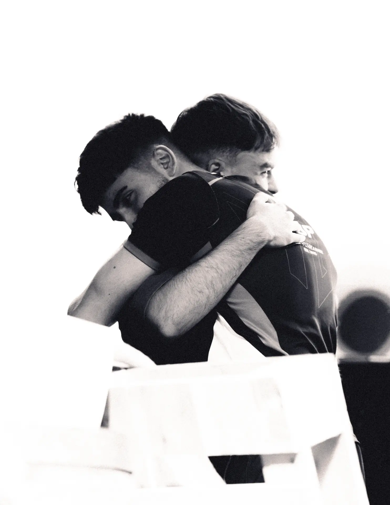 TLF players embrace after a match